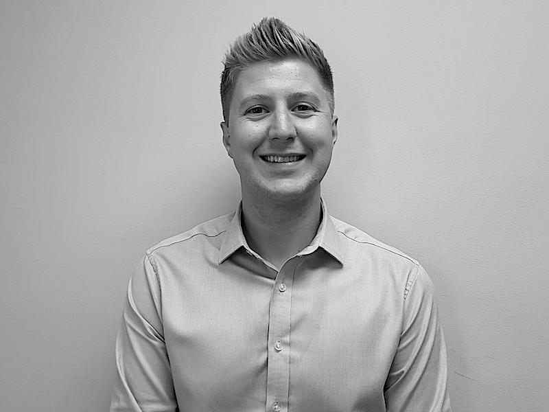 A black and white photo of Group Sales Manager Stewart Turner
